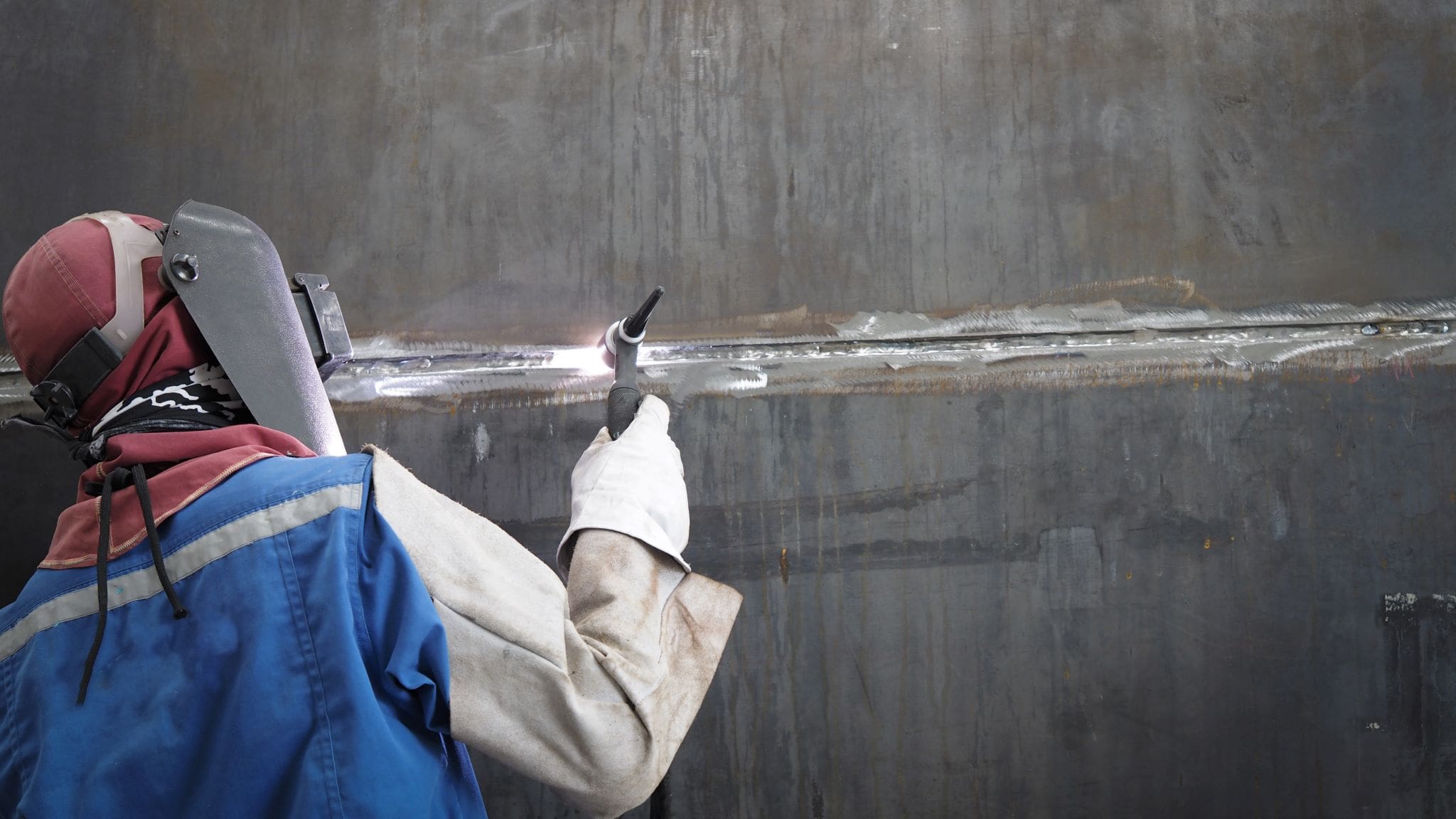 welder working on a boiler or pressure vessel