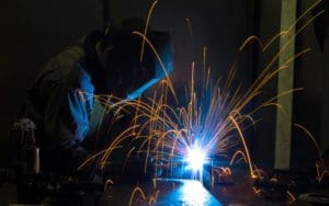Close up view of a welder welding pieces of metal together